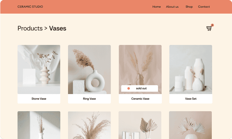 You can see an online store for pottery with various ceramic products such as vases. The store has a light and beige design.
