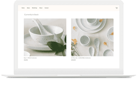 Online store built by artist selling pottery shown on a laptop.